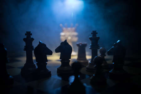 Beautiful crown miniature on chessboard. chess board game concept of business ideas and competition...