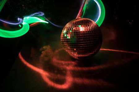 Colorful disco mirror ball lights night club background. Party lights disco ball. Selective focus