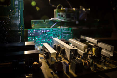 Creative concept of modern technology, inside an electronic device. Electronic circuit board close...