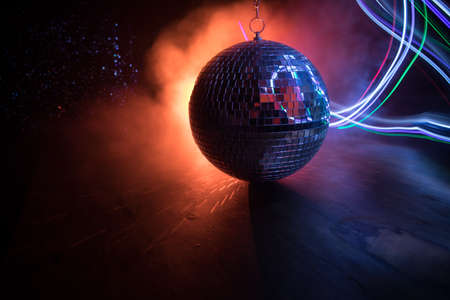 Colorful disco mirror ball lights night club background. Party lights disco ball. Selective focusの写真素材