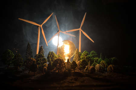 Electricity power in nature or clean energy concept. Wind Turbine producing alternative energy at...
