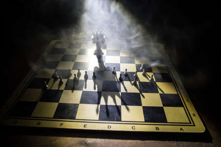 Beautiful crown miniature on chessboard. chess board game concept of business ideas and competition...
