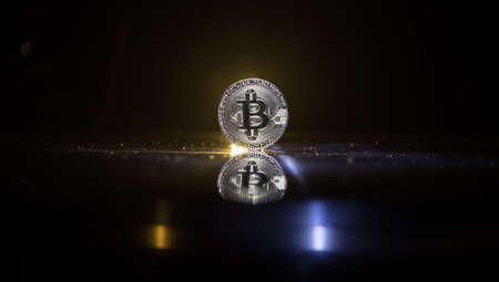 Golden Bitcoin on dark backround. New virtual money. Crypto currency. Creative artwork decoration....