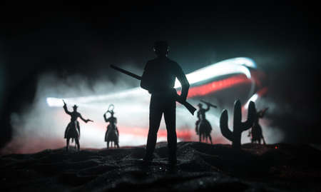 Western concept. Battle between cowboys at night. Duel to the death. Creative artwork decoration on...