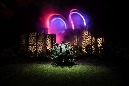 Cartoon style city buildings. Realistic city building miniatures with lights. Big virus miniature in...
