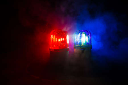 Police car blue and red round vintage siren in dark. Rotating retro style police siren. Selective focusの写真素材