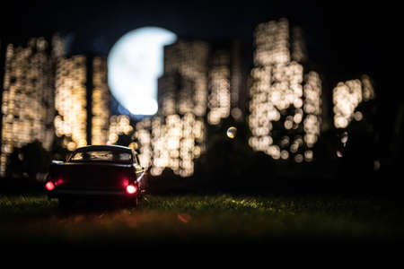 Cartoon style city buildings. Realistic city building miniatures with lights. ... Car miniature in...