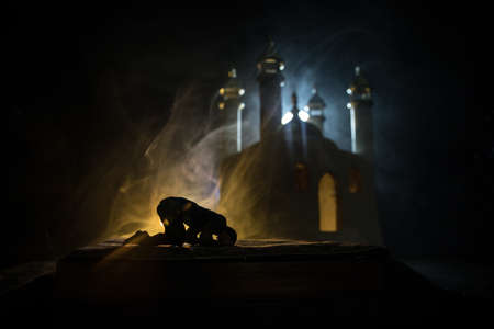 Silhouette of mosque building on toned foggy background. Ramadan Kareem background. Realistic mosque...