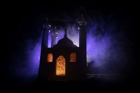 A realistic Mosque miniature with windows at night. Festive greeting card, invitation for Muslim...