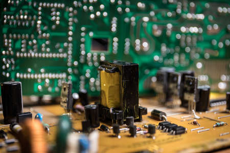 Creative concept of modern technology, inside an electronic device. Electronic circuit board close...
