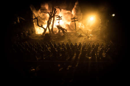 War Concept. Military silhouettes fighting scene on war fog sky background, World War Soldiers Silhouette Below Cloudy Skyline At night. German soldiers in ranks. Selective focusの写真素材