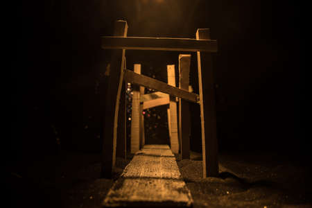 Creative artwork decoration. Abstract Japanese style wooden tunnel at night. Night scene in fantasy forest. Selective focusの写真素材