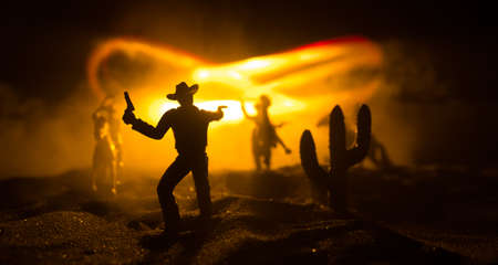Western concept. Battle between cowboys at night. Duel to the death. Creative artwork decoration on...