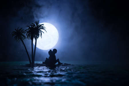 Romantic night scene. Fantasy night landscape with little island with palms and full moon over sea....