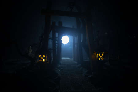 Creative artwork decoration. Abstract Japanese style wooden tunnel at night. Night scene in fantasy...
