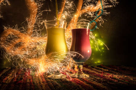 New Year and Christmas party concept. Different tasty cocktails with creative New Year holiday artwork decoration on background. Colorful cocktail in glass. Party club entertainment. Copy space.の写真素材