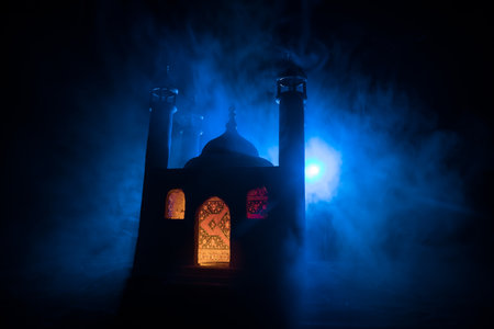A realistic Mosque miniature with windows at night. Festive greeting card, invitation for Muslim holy month Ramadan Kareem. Selective focusの写真素材