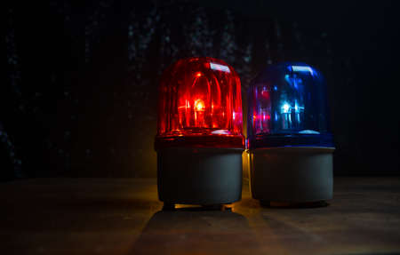 Police car blue and red round vintage siren in dark. Rotating retro style police siren. Selective focusの写真素材