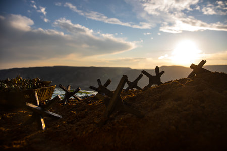 World War 2 reenactment (D-day). Creative decoration with toy soldiers, landing crafts and hedgehogs. Battle scene of Normandy landing on June 6, 1944. Selective focusの写真素材