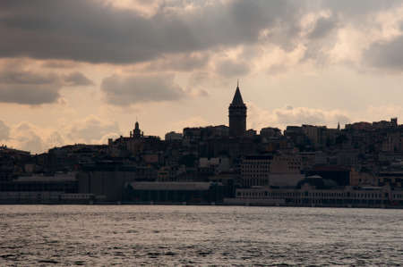 ISTANBUL, TURKEY - 06/11/2021. Cityscape of Istanbul at the evening, seaside view with silhouettes...