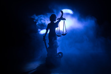 No law or dictatorship concept. The Statue of Justice with anti-riot police helmet holding scale. Creative artwork decoration with colorful toned foggy background. Selective focusの写真素材