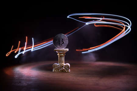 Golden Bitcoin on dark backround. New virtual money. Crypto currency. Creative artwork decoration....