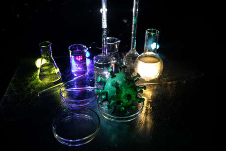Corona virus Vaccine concept with syringe and green Corona virus novel miniature. Vaccine Concept of...