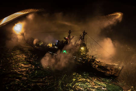 War concept. Night battle scene at sea. Dramatic toned clouds effect. Silhouette of the battle ship...