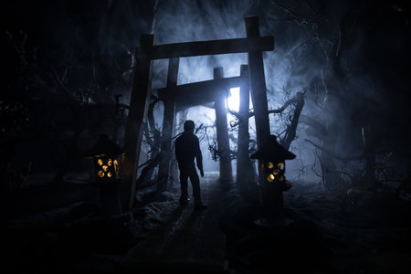 Creative artwork decoration. Abstract Japanese style wooden tunnel at night. Night scene in fantasy...
