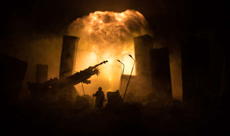 Nuclear war concept. Explosion of nuclear bomb. Apocalyptic view of city downtown after bombing. Night scene. City destroyed by war.の写真素材