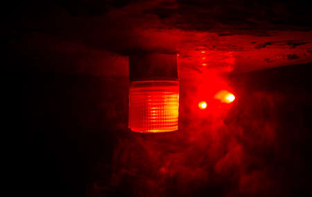 Police car red round vintage siren in dark. Rotating retro style police siren. Selective focusの写真素材