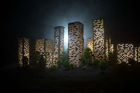 Cartoon style city buildings. Realistic city building miniatures with lights. background. Decorative city. Selective focusの写真素材