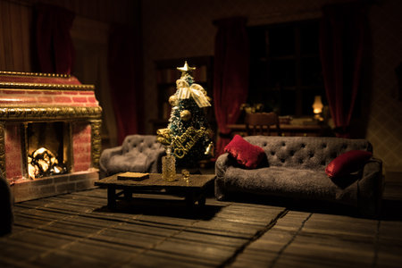 Christmas and New Year holidays concept. A realistic dollhouse living room with furniture and window at night. Artwork table decoration with handmade realistic dollhouse. Selective focus.の写真素材