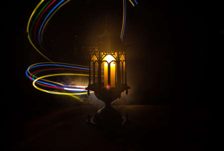 Arabic lantern with candle at night for Islamic holiday. Muslim holy month Ramadan. The end of Eid...
