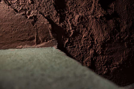 Dark brown stone old concrete wall background texture grunge and brown surface with spaceの写真素材