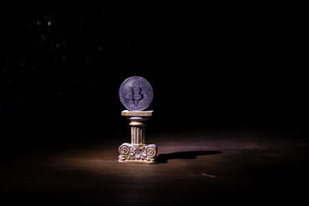 Golden Bitcoin on dark backround. New virtual money. Crypto currency. Creative artwork decoration. Selective focusの写真素材