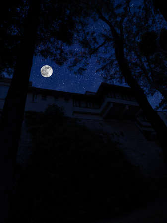 Full moon over the city at night, Istanbul, Turkey. Big full moon shining bright over buildings. Night cityscapeの写真素材