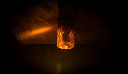 Emergency lighting in the factory, Warning light, Orange siren on concrete wall. Rotating siren.の写真素材