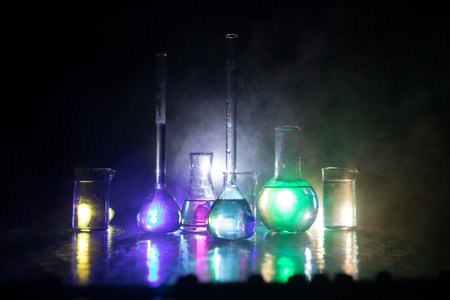 Pharmacy and chemistry theme. Test glass flask with solution in research laboratory. Science and...