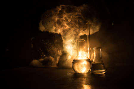 Pharmacy and chemistry theme. Test glass flask with solution in research laboratory. Science and medical background. Laboratory test tubes on abstract explosion cloud background. Selective focusの素材 [FY310179050464]