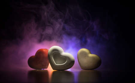 Valentines background. Valentine's Day heart on a dark wooden table. Dark toned foggy background. Selective focusの写真素材