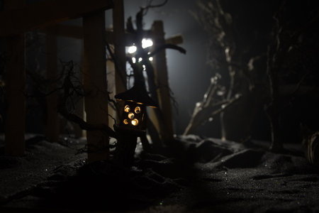 Creative artwork decoration. Abstract Japanese style wooden tunnel at night. Night scene in fantasy forest. Selective focusの写真素材