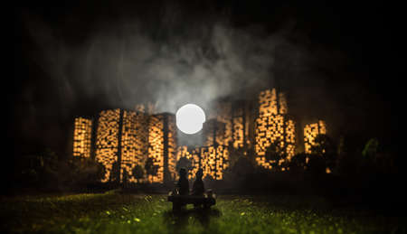 Cartoon style city buildings. Realistic city building miniatures with lights. background. Romantic...