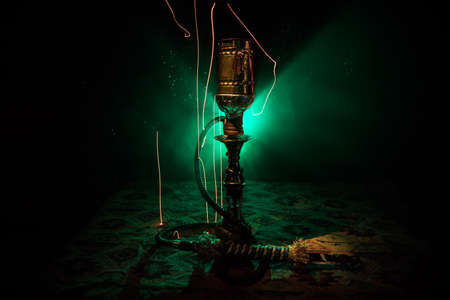 Shisha Concept. Hookah hot coals on shisha bowl with black background. Stylish oriental shisha with...