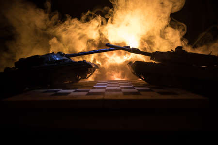 War between Russia and Ukraine, conceptual image of war using chess board and tank on a dark background of explosion. Ukrainian and Russian crisis, political conflict. selective focusの写真素材