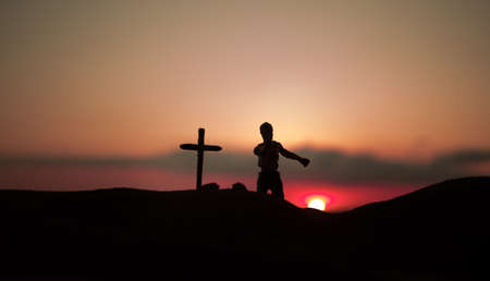 Silhouette some zombies on the cemetery walking around at sunset. Horror Halloween concept. selective focusの写真素材