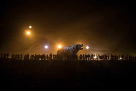 Creative artwork decoration - Russian war in Ukraine concept. Crowd looking at giant explosion and attacking giant bear. selective focusの写真素材