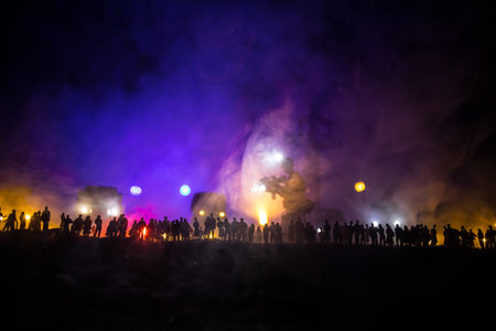 Creative artwork decoration - Russian war in Ukraine concept. Crowd looking at giant explosion and attacking soldiers. selective focusの写真素材