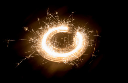 Music DJ concept. Trail of fire and smoke on vinyl record. Burning vinyl disk. Turntable vinyl record player on dark background. selective focusの写真素材