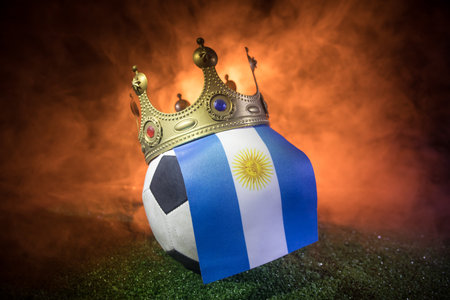 Soccer 2022. Grand Final Argentina vs France theme. soccer ball on green grass. Support your country or cheer concept. selective focusの写真素材